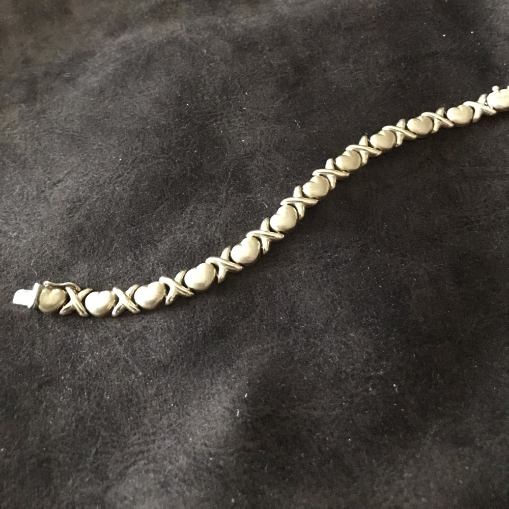 Gold bracelet with X’s and hearts